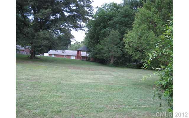 384 Pitts School Road Northwest Concord, NC 28027 - Photo 4 of 4 a backyard of a house with lots of green space