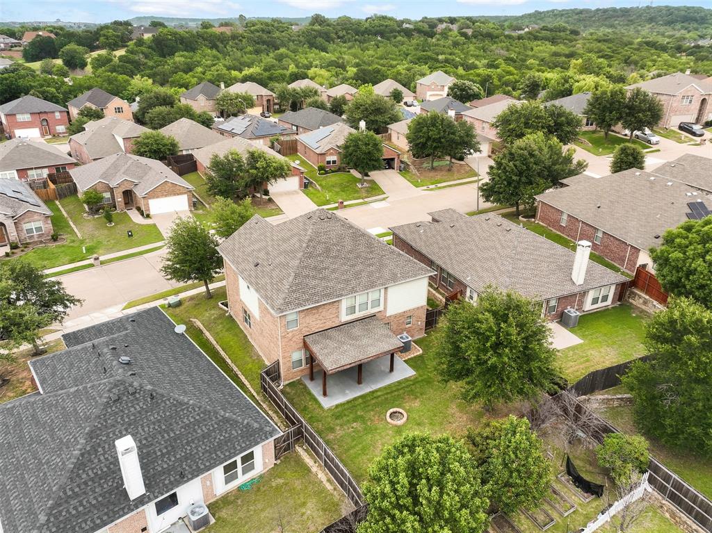 6522 Portside Ridge Lane Dallas, TX 75249 - Photo 35 of 37 Two-story residence with brick exterior and covered patio