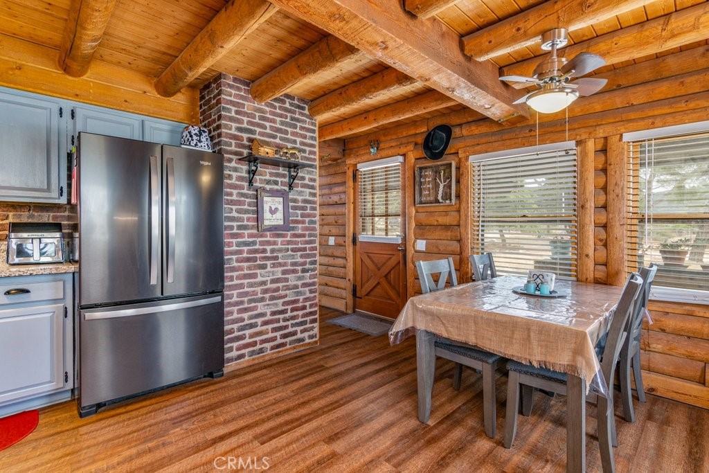 37325 Bohlen Road Anza, CA 92539 - Photo 15 of 43 a view of a dining room with furniture window and wooden floor