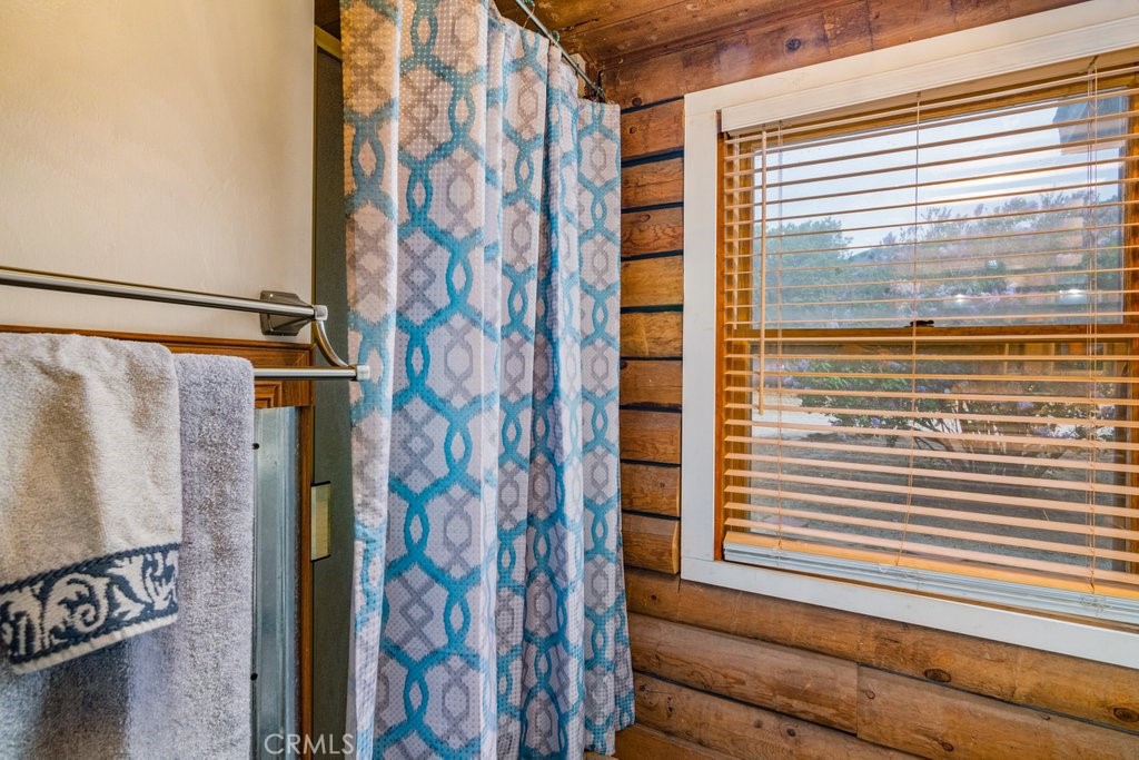 37325 Bohlen Road Anza, CA 92539 - Photo 19 of 43 a view of a bathroom with a shower and a window