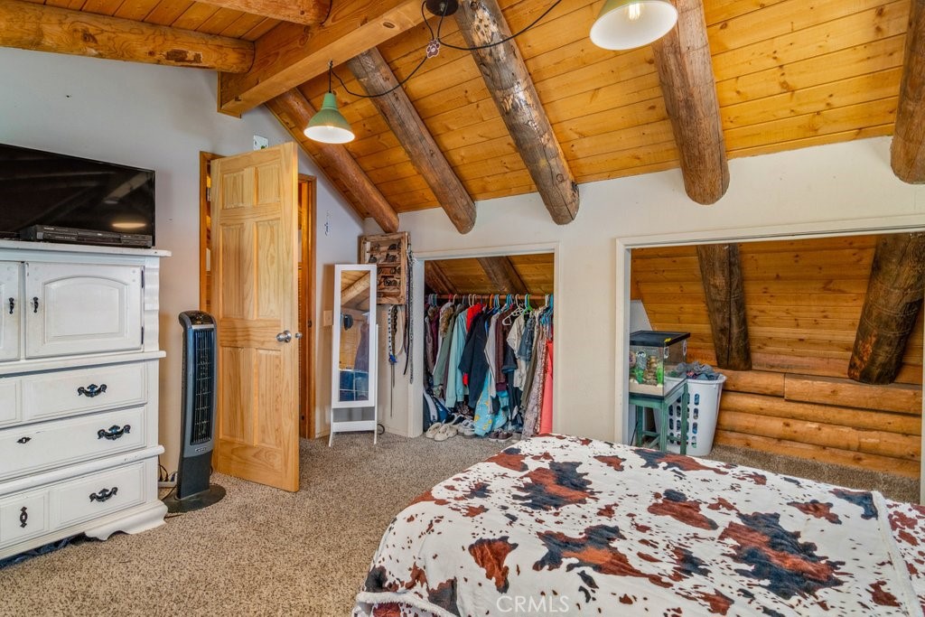 37325 Bohlen Road Anza, CA 92539 - Photo 27 of 43 a view of walk in closet with clothes and shoes