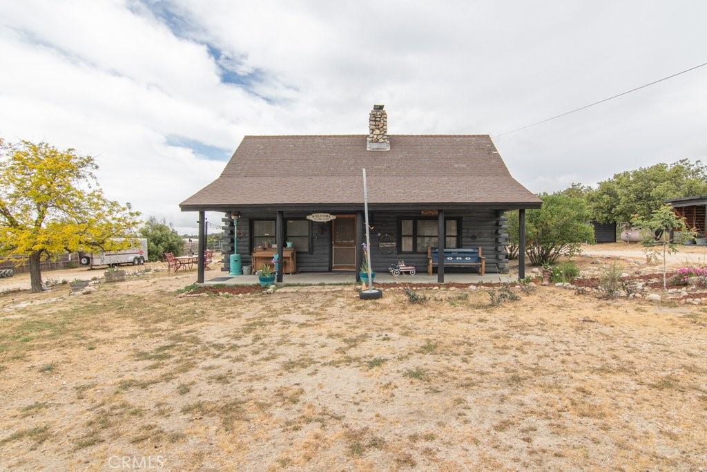 37325 Bohlen Road Anza, CA 92539 - Photo 6 of 43 a backyard of a house with table and chairs