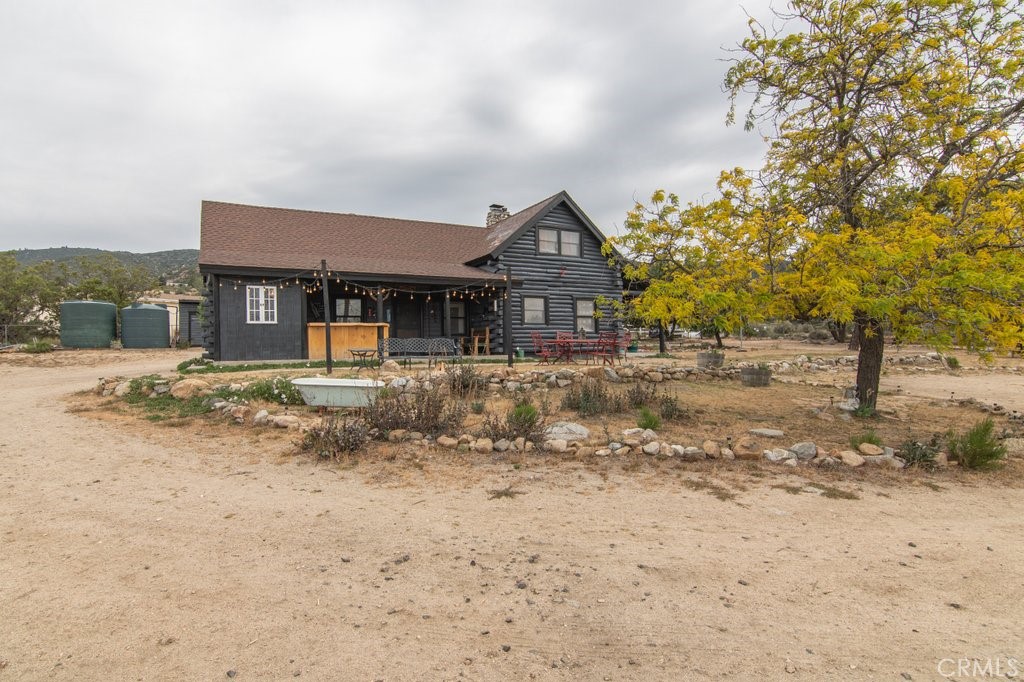 37325 Bohlen Road Anza, CA 92539 - Photo 10 of 43 a front view of a house with a yard