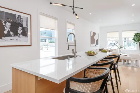 a dining room with a table and chairs