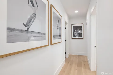 a view of a hallway with window and stairs