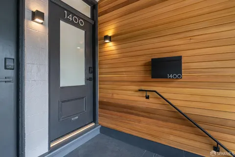 a view of a door and brick wall