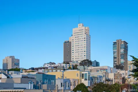 a view of a city with tall buildings