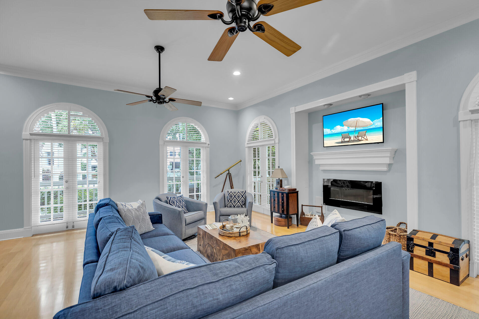 64 Front Street Key West, FL 33040 - Photo 11 of 57 a living room with furniture a fireplace and a chandelier