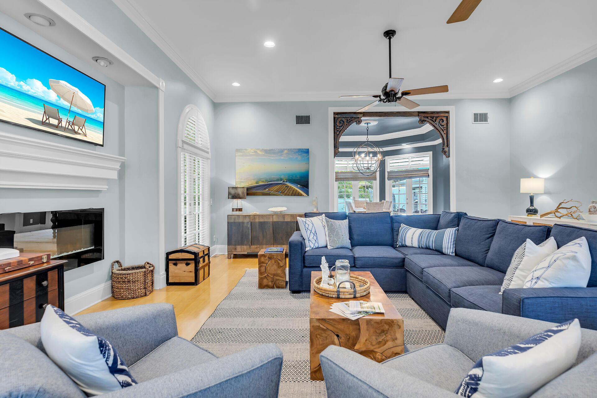 64 Front Street Key West, FL 33040 - Photo 12 of 57 a living room with furniture a fireplace and a flat screen tv