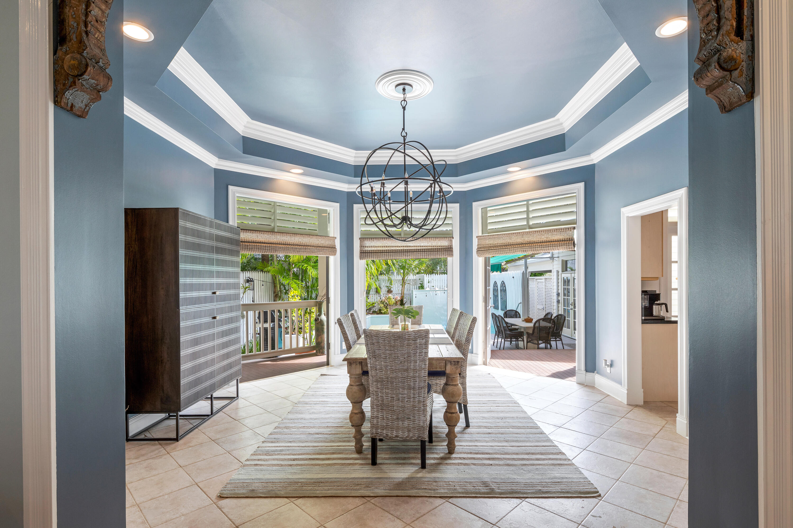 64 Front Street Key West, FL 33040 - Photo 15 of 57 a view of a dining room with furniture wooden floor and chandelier