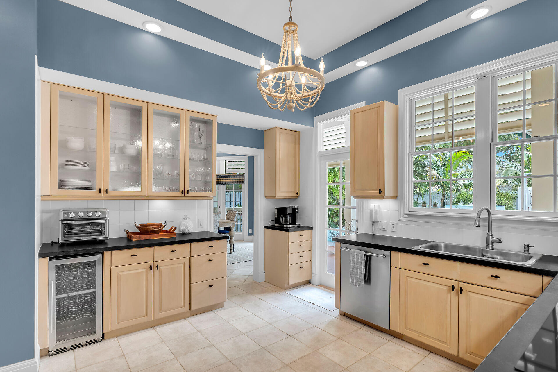 64 Front Street Key West, FL 33040 - Photo 18 of 57 a kitchen with stainless steel appliances a sink stove and cabinets