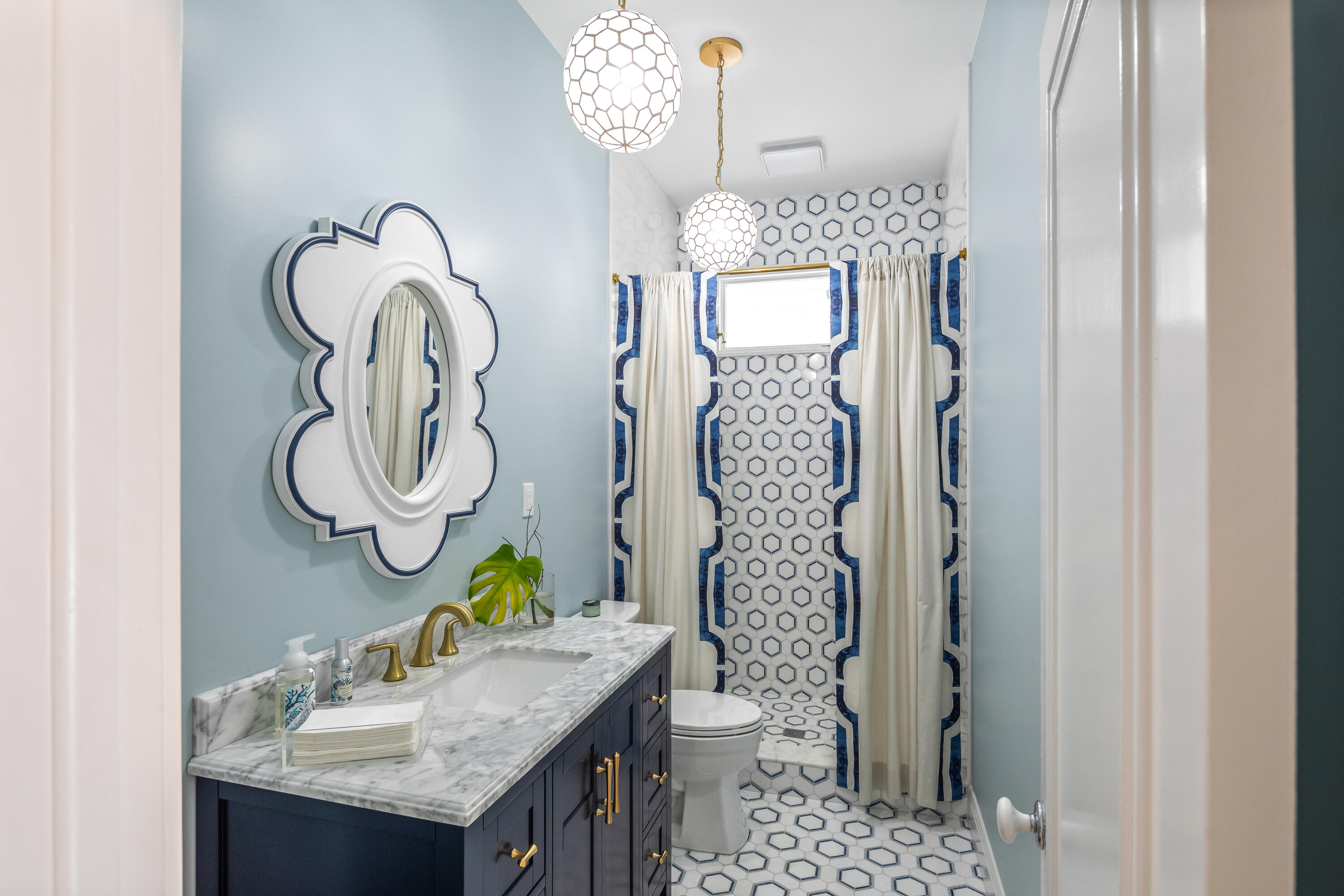 64 Front Street Key West, FL 33040 - Photo 20 of 57 a bathroom with a sink vanity mirror and toilet