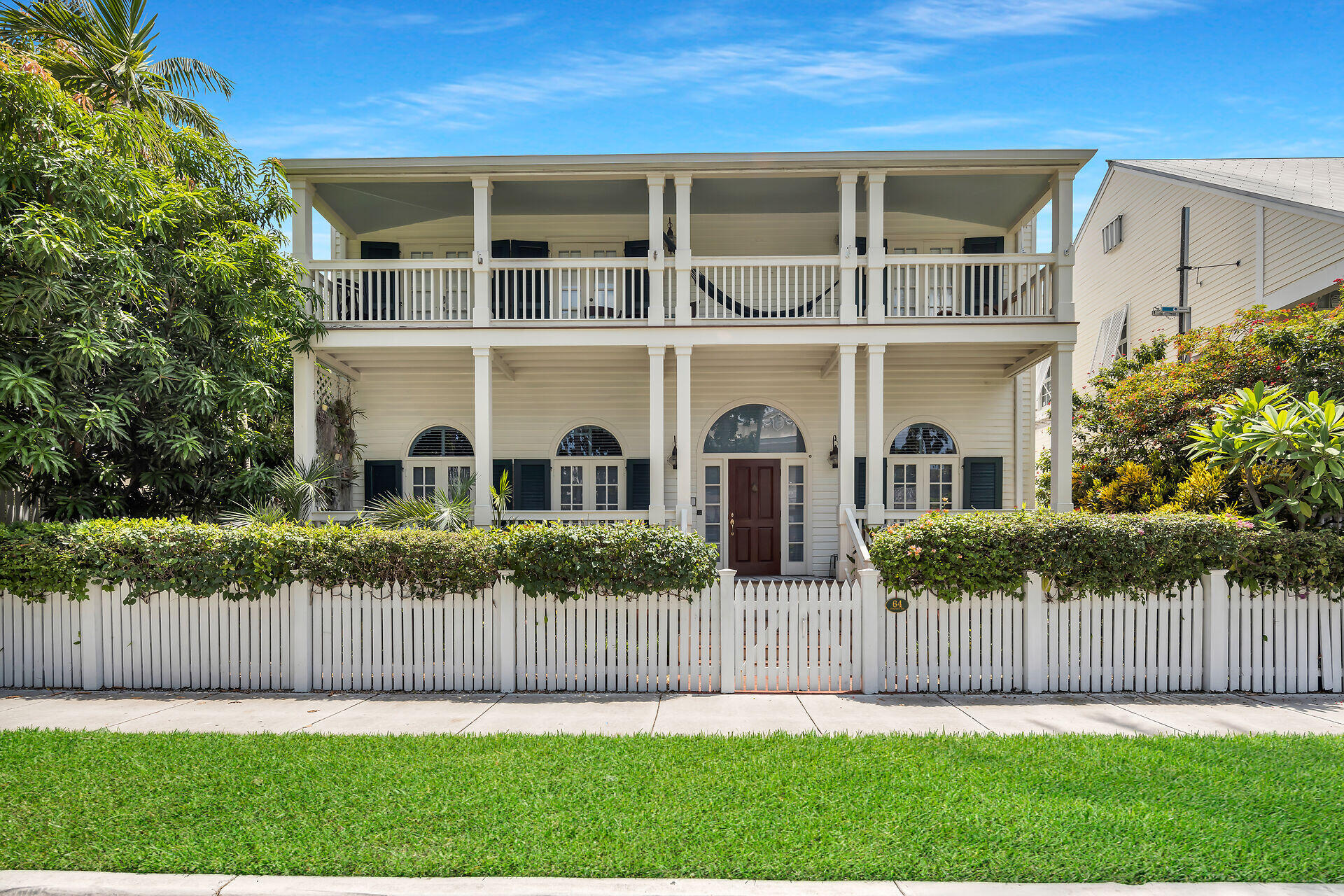 64 Front Street Key West, FL 33040 - Photo 2 of 57 a front view of house with yard and green space