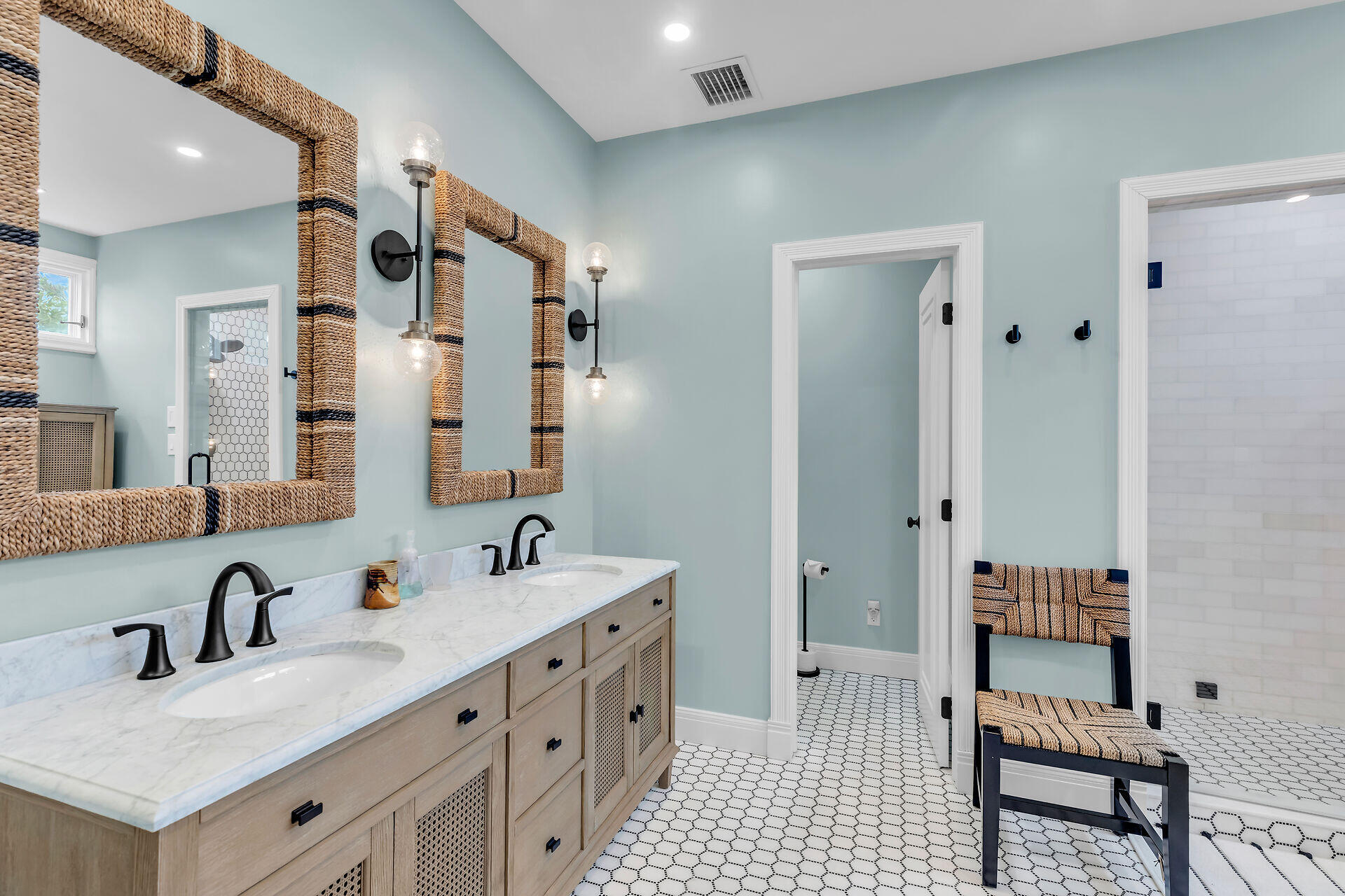 64 Front Street Key West, FL 33040 - Photo 30 of 57 a bathroom with double sink and a mirror