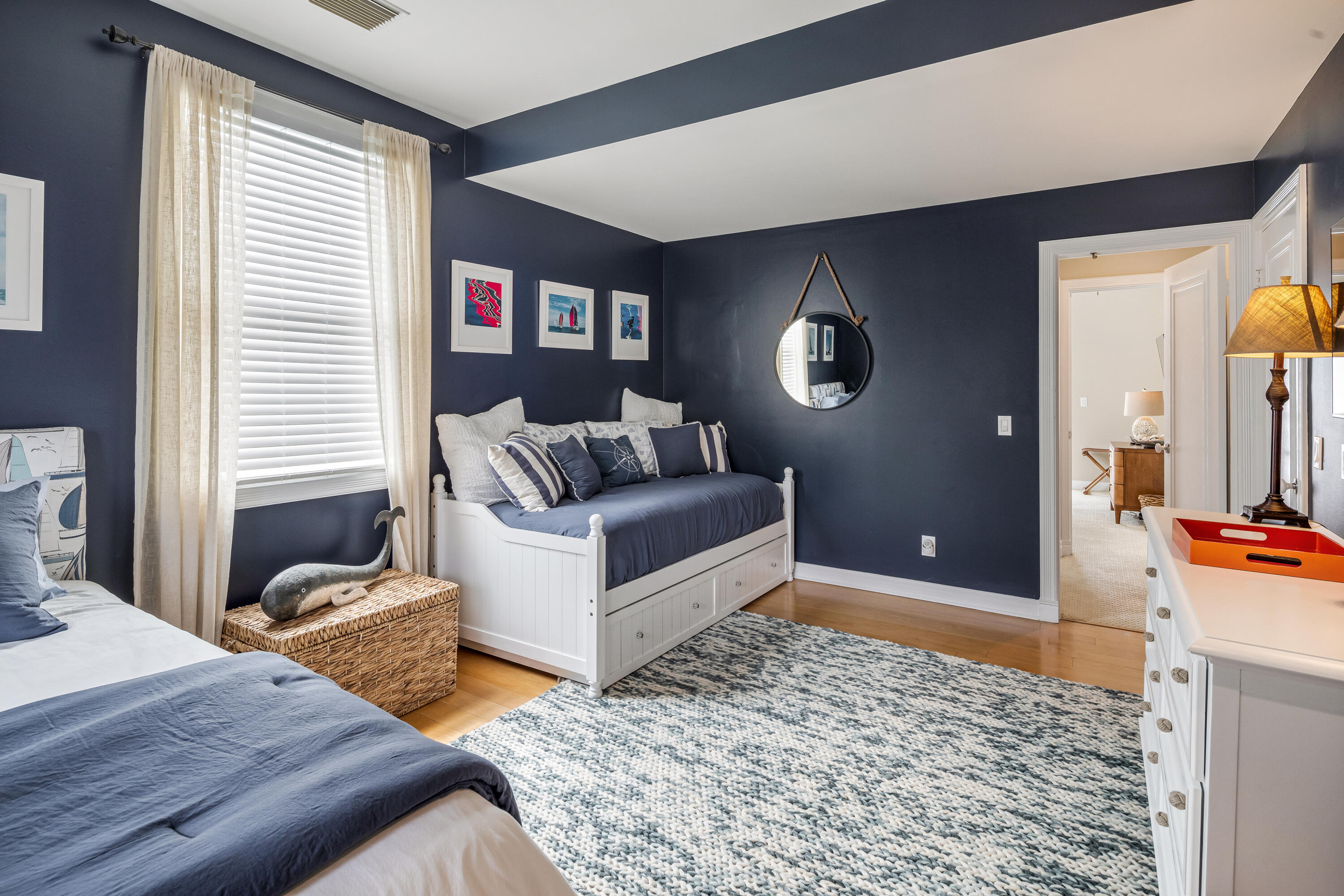 64 Front Street Key West, FL 33040 - Photo 34 of 57 a bedroom with furniture and a wooden floor