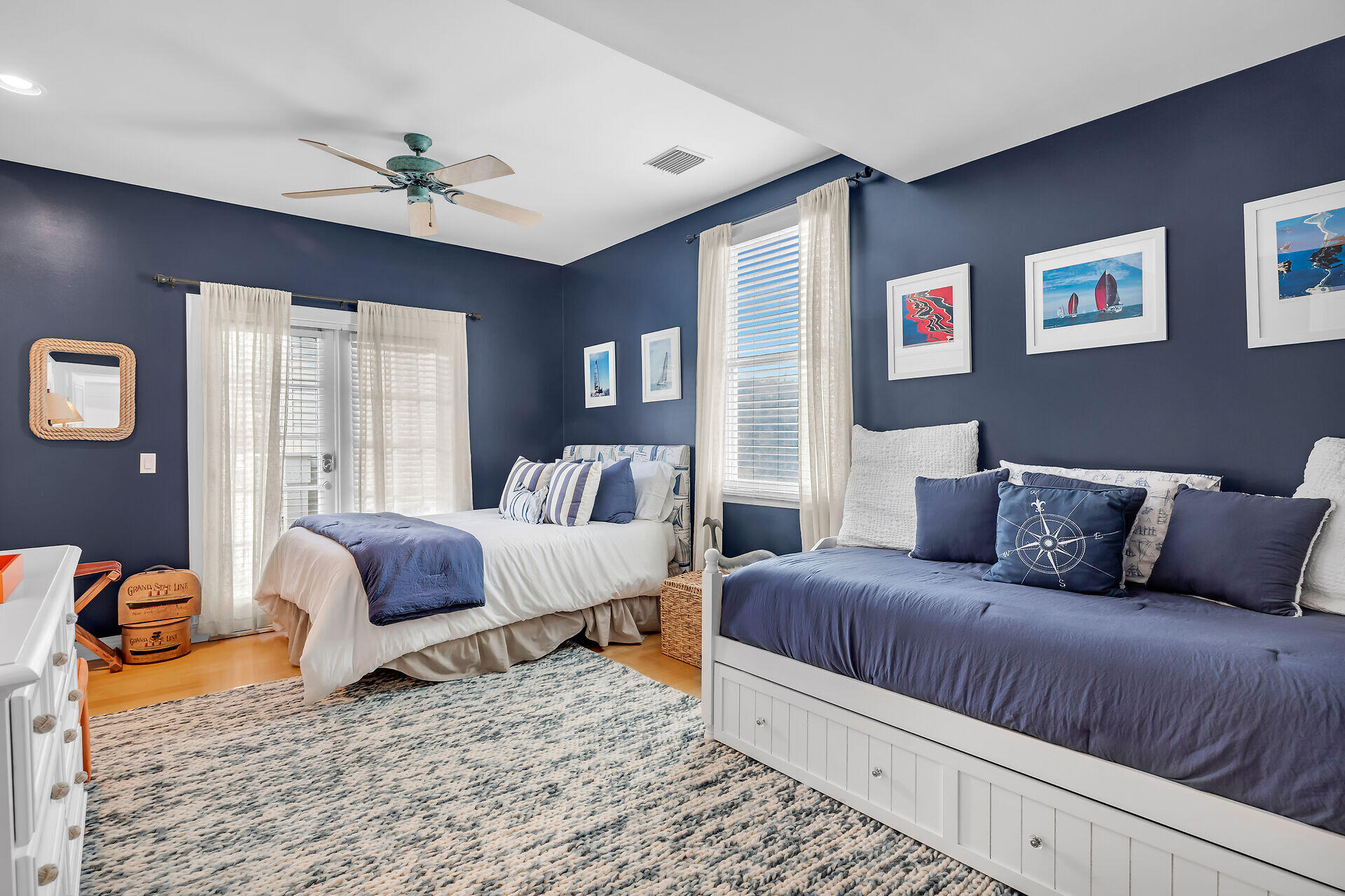 64 Front Street Key West, FL 33040 - Photo 37 of 57 a bedroom with a bed and wooden floor