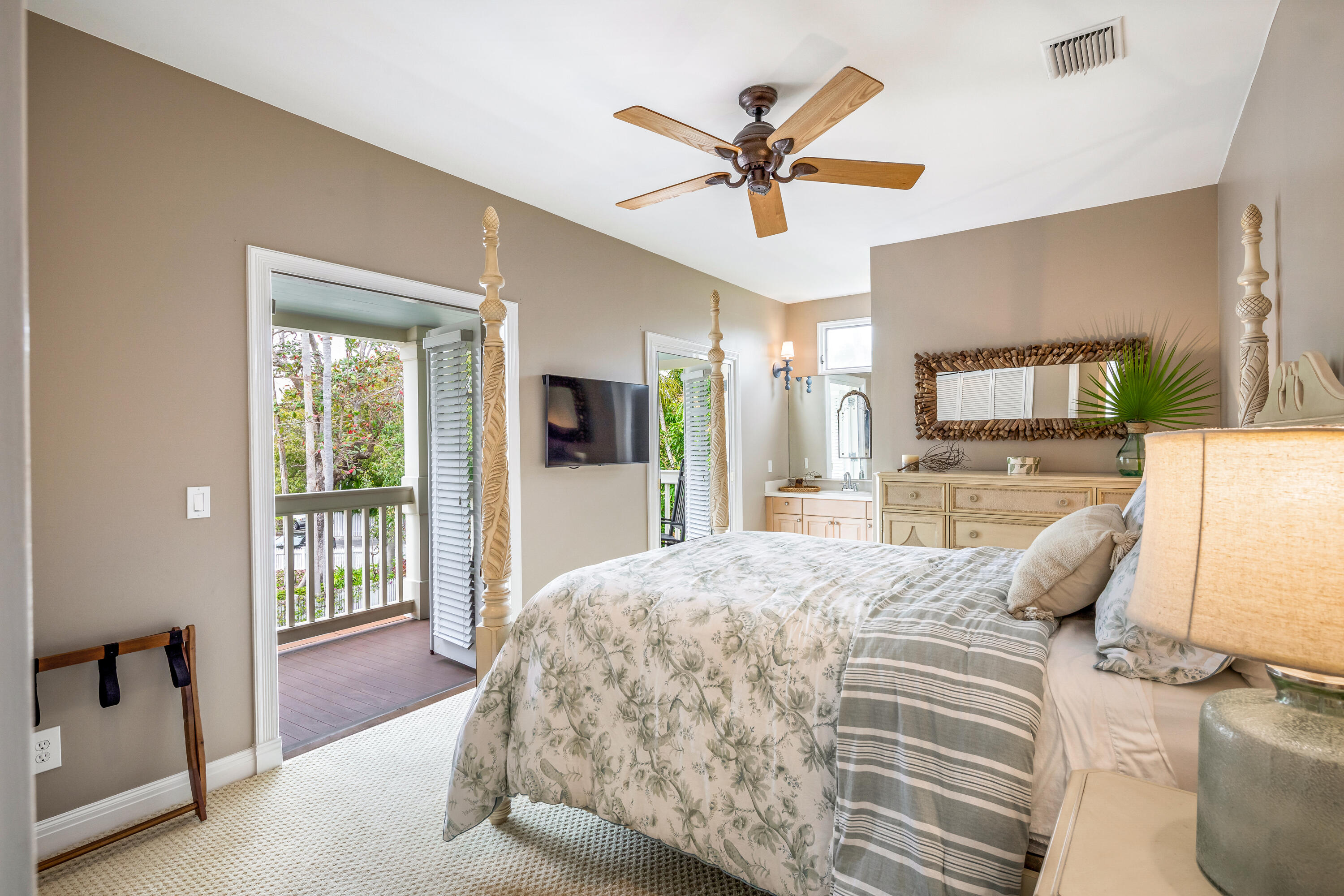 64 Front Street Key West, FL 33040 - Photo 41 of 57 a living room with a bed furniture and a large window