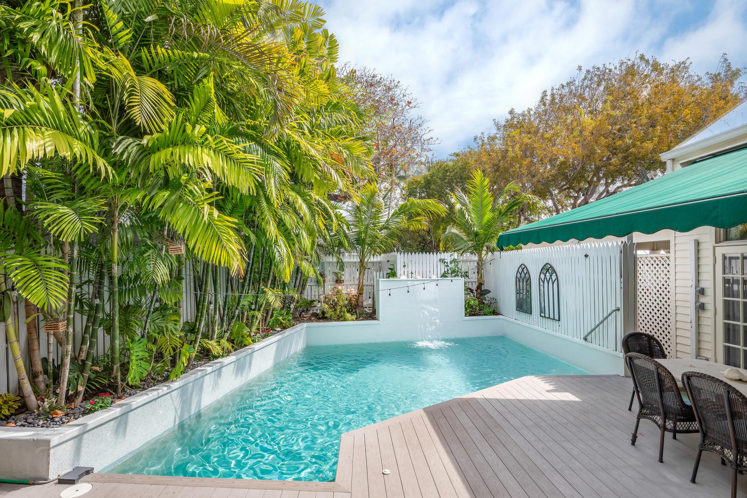 64 Front Street Key West, FL 33040 - Photo 43 of 57 a view of a backyard with sitting area