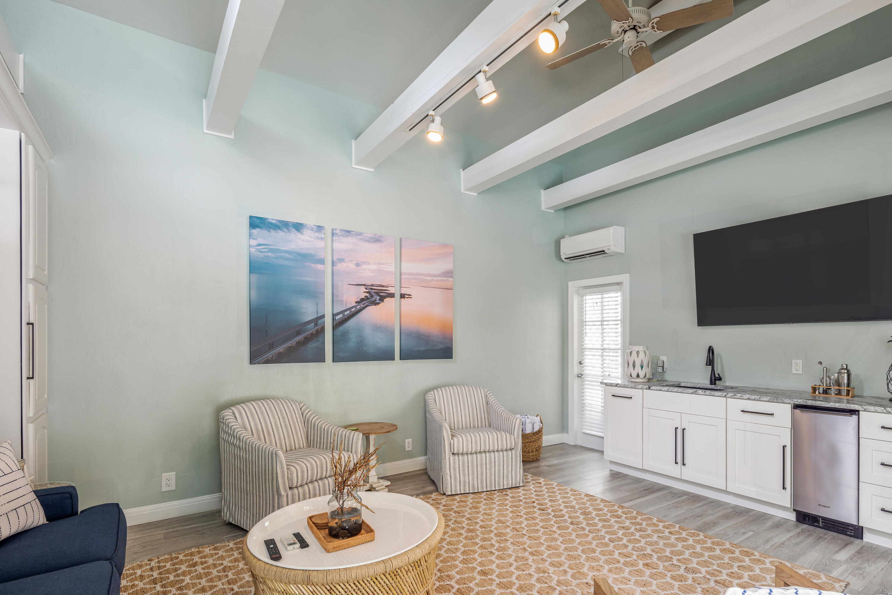 64 Front Street Key West, FL 33040 - Photo 47 of 57 a living room with furniture and a flat screen tv