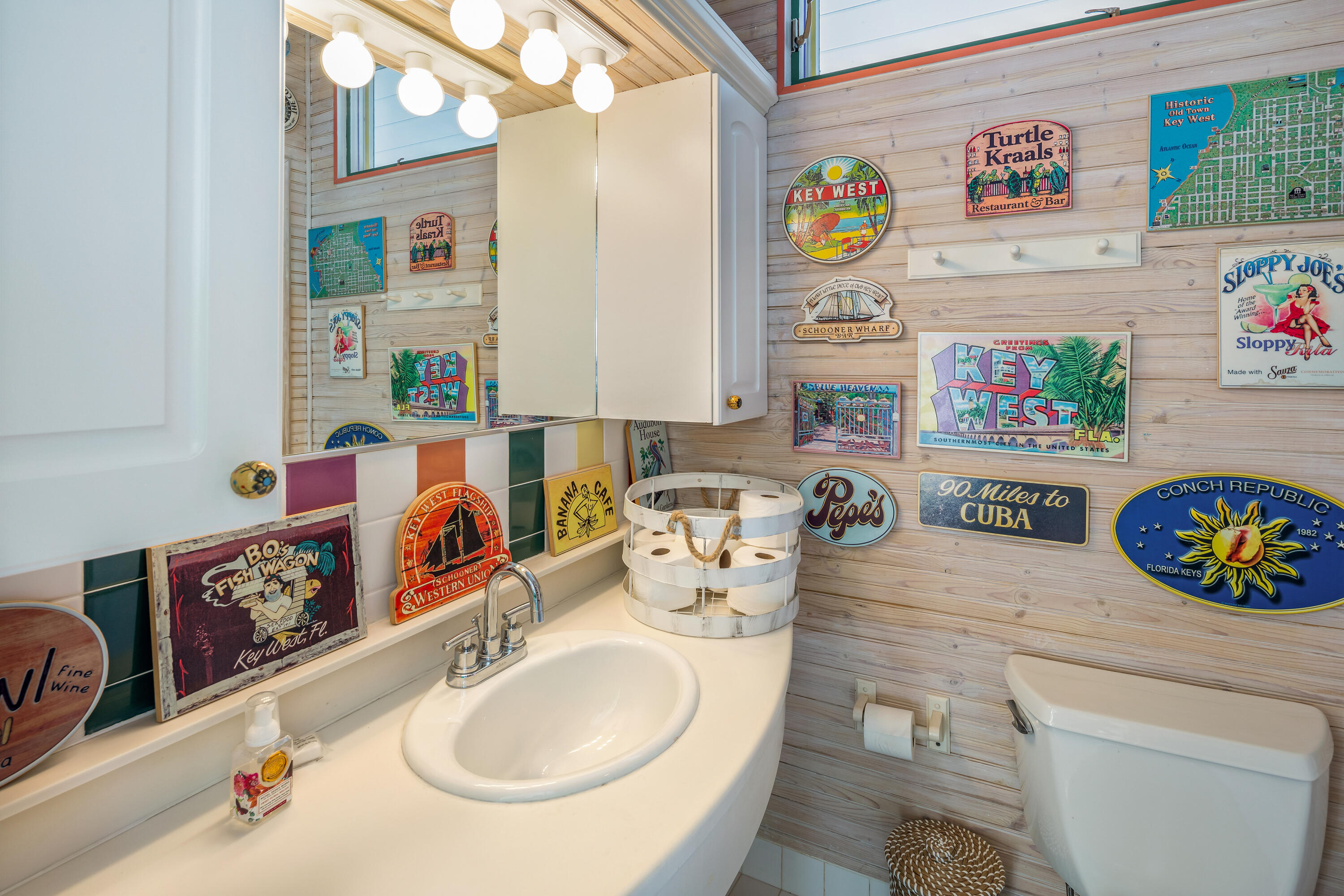 64 Front Street Key West, FL 33040 - Photo 50 of 57 a bathroom with a sink a vanity and a shower curtain