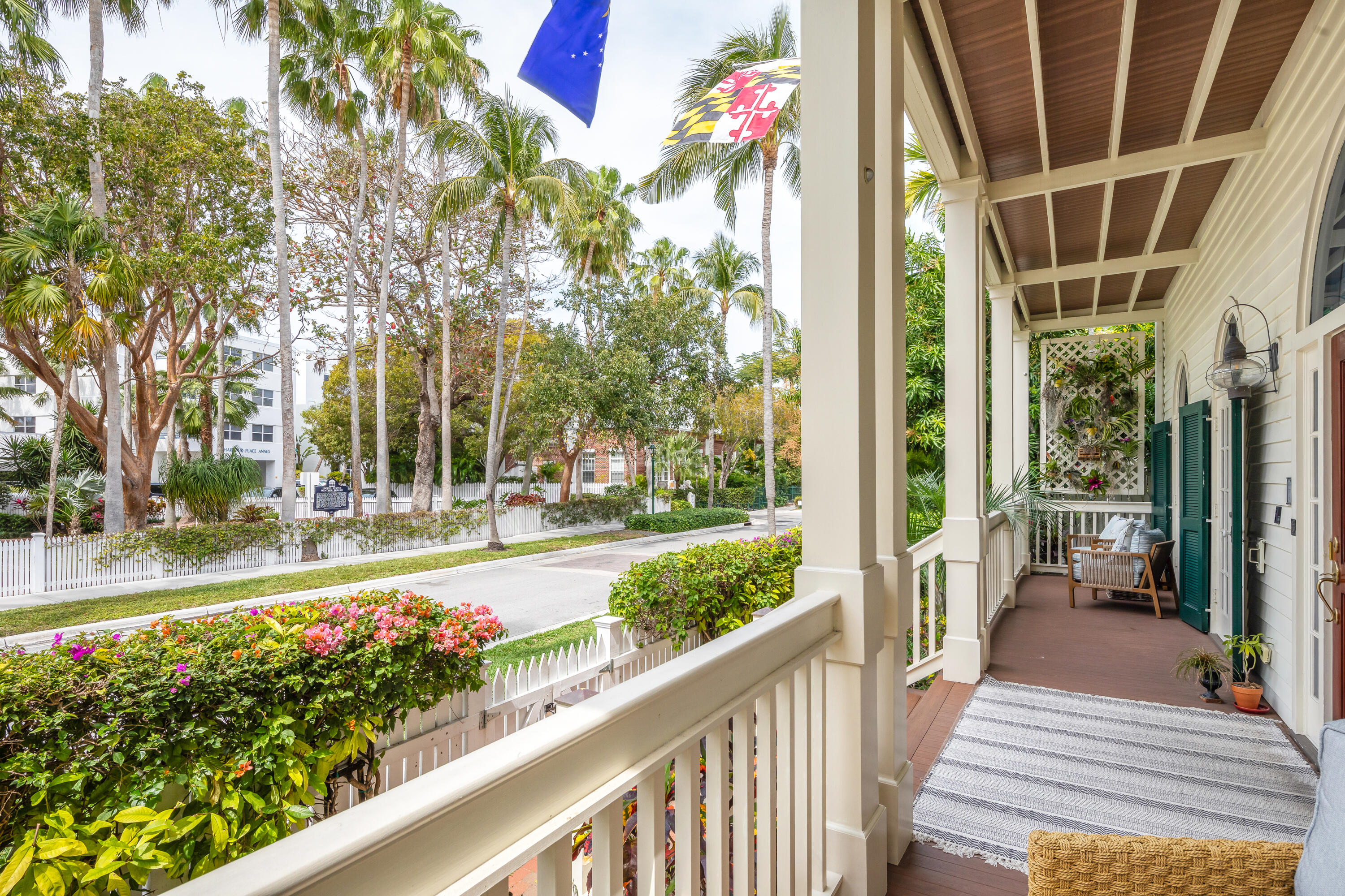 64 Front Street Key West, FL 33040 - Photo 6 of 57 a view of a pathway of a house with a porch