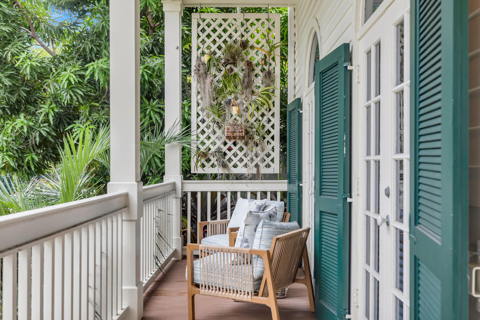 64 Front Street Key West, FL 33040 - Photo 7 of 57 a view of a balcony with chair and wooden floor