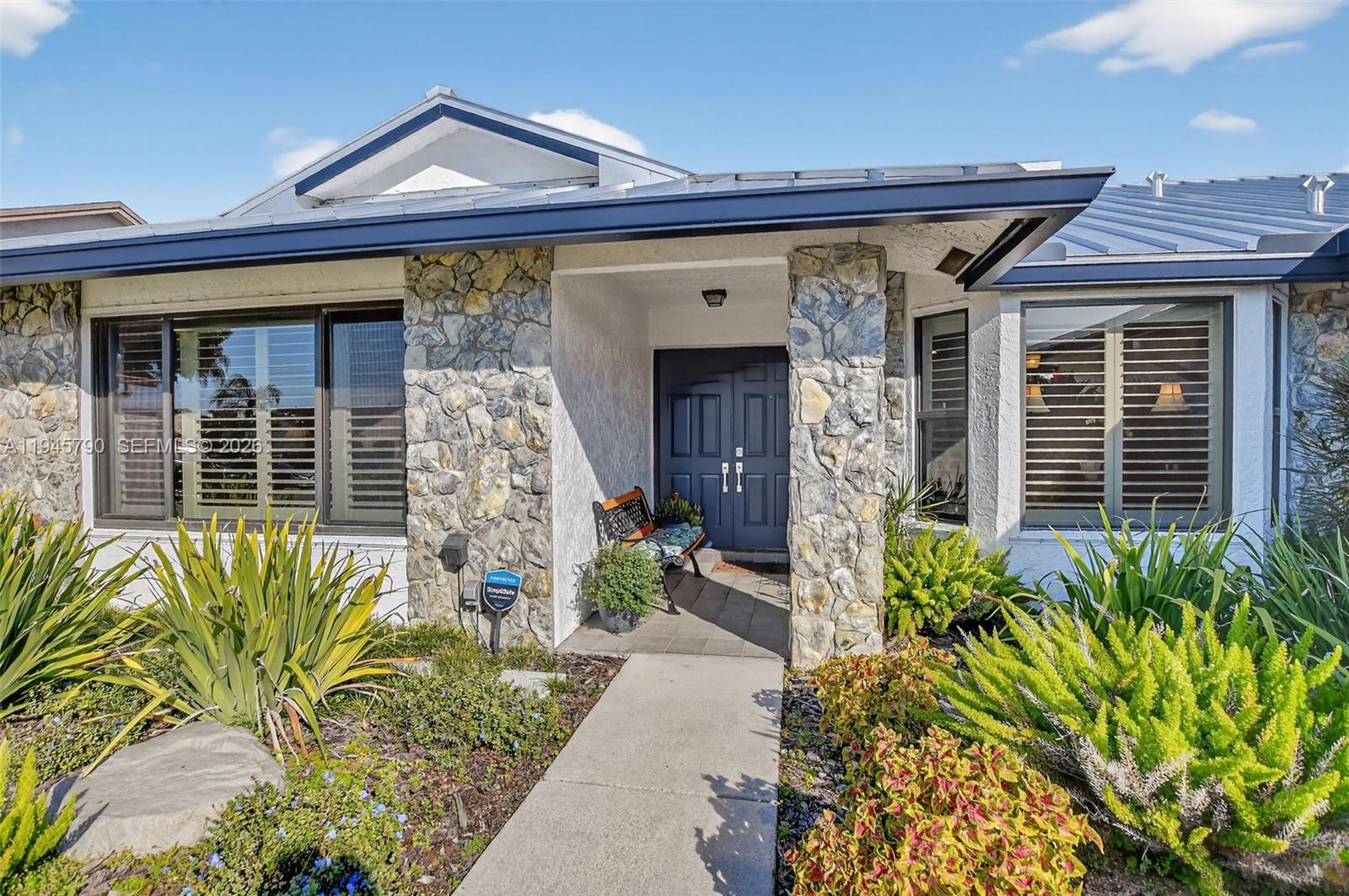 9943 Majorca Place Boca Raton, FL 33434 - Photo 2 of 48 a front view of a house