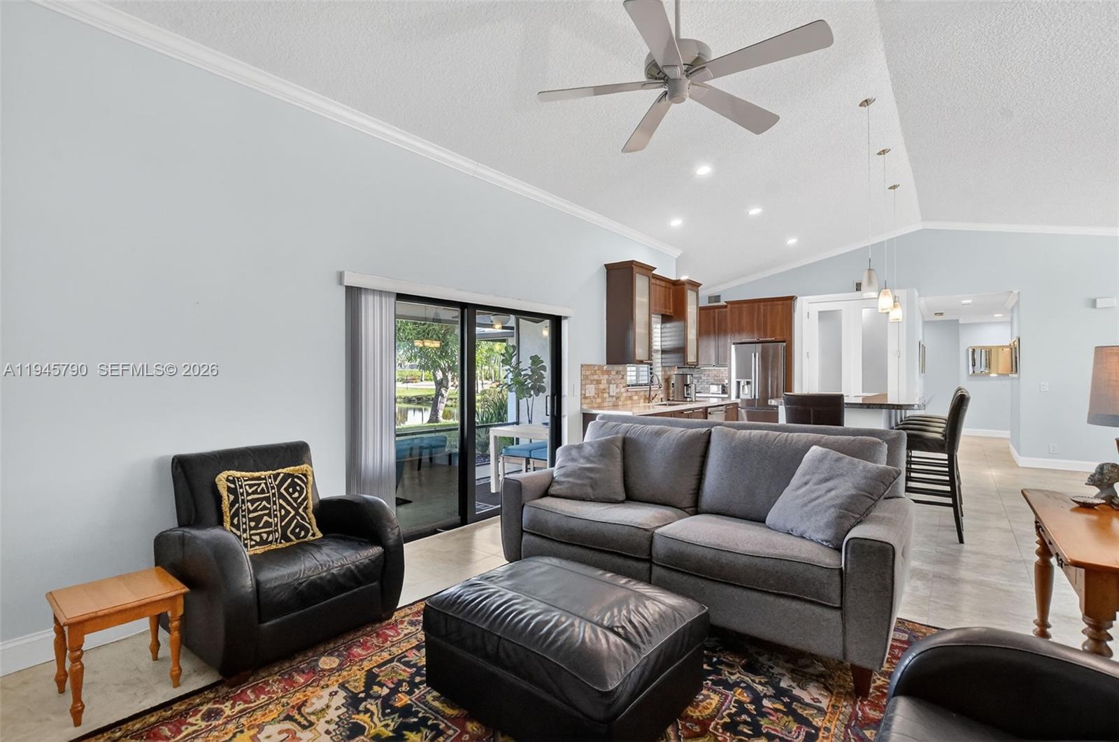 9943 Majorca Place Boca Raton, FL 33434 - Photo 26 of 48 a living room with furniture and a large window