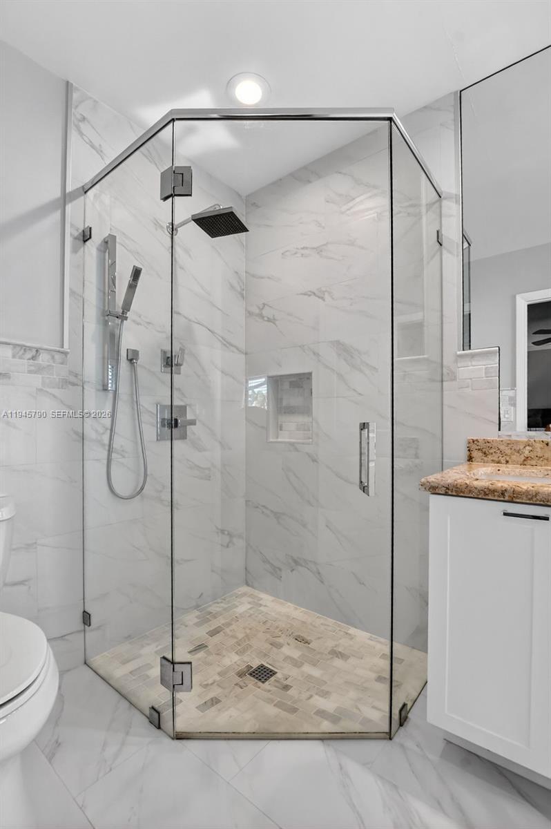 9943 Majorca Place Boca Raton, FL 33434 - Photo 32 of 48 a bathroom with a shower and a bathroom