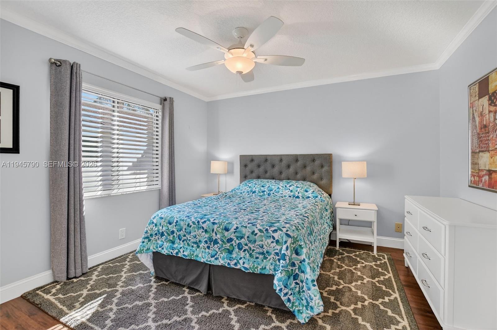 9943 Majorca Place Boca Raton, FL 33434 - Photo 34 of 48 a bedroom with a bed and a window