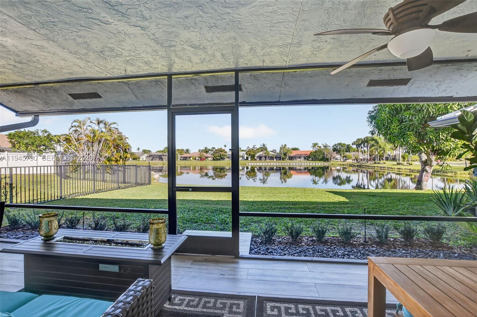 9943 Majorca Place Boca Raton, FL 33434 - Photo 42 of 48 a view of a porch with furniture and garden