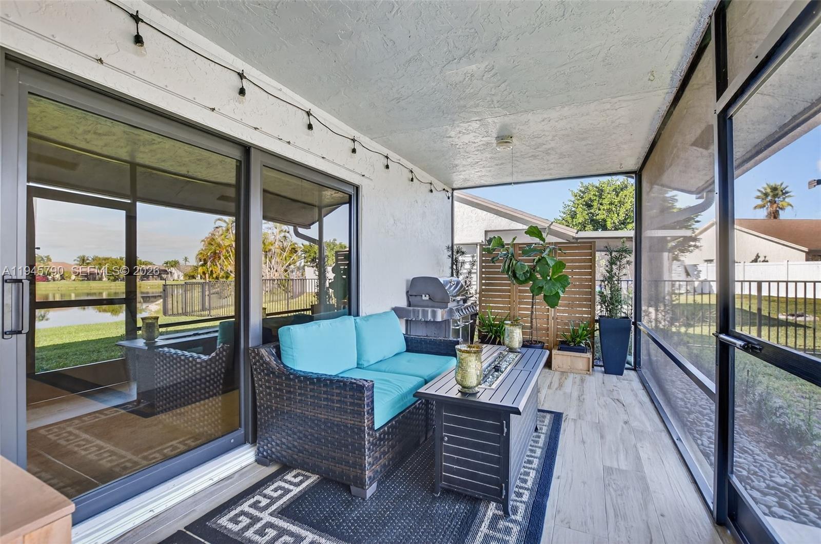 9943 Majorca Place Boca Raton, FL 33434 - Photo 43 of 48 a living room with large windows