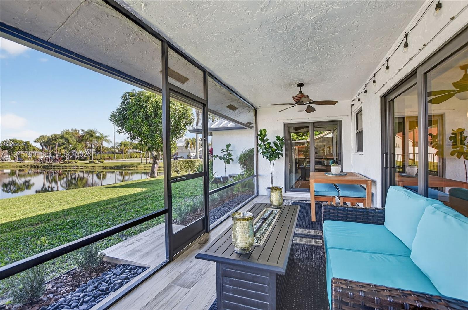 9943 Majorca Place Boca Raton, FL 33434 - Photo 45 of 48 a view of a porch with furniture and garden