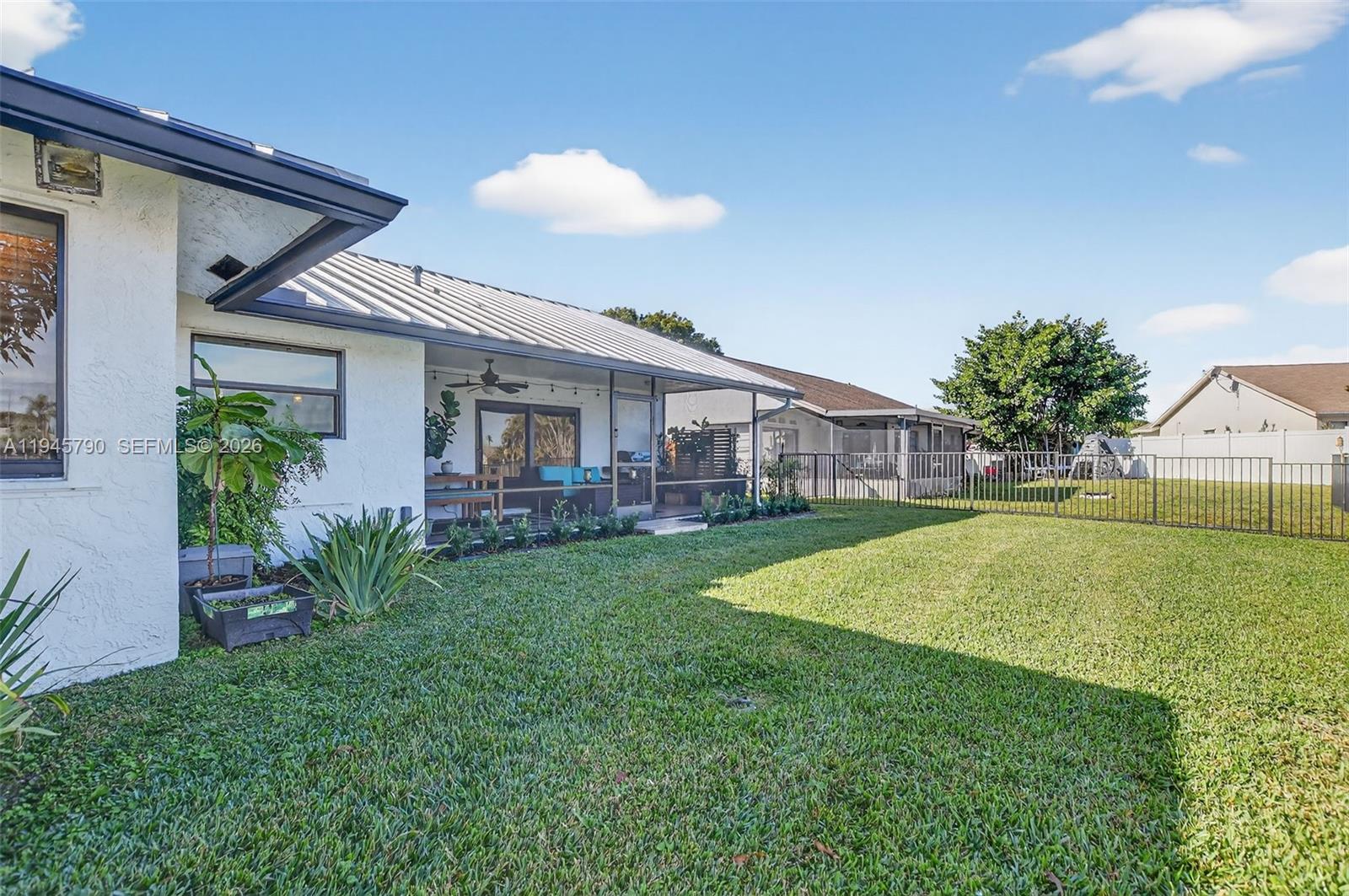 9943 Majorca Place Boca Raton, FL 33434 - Photo 47 of 48 a view of a house with a backyard