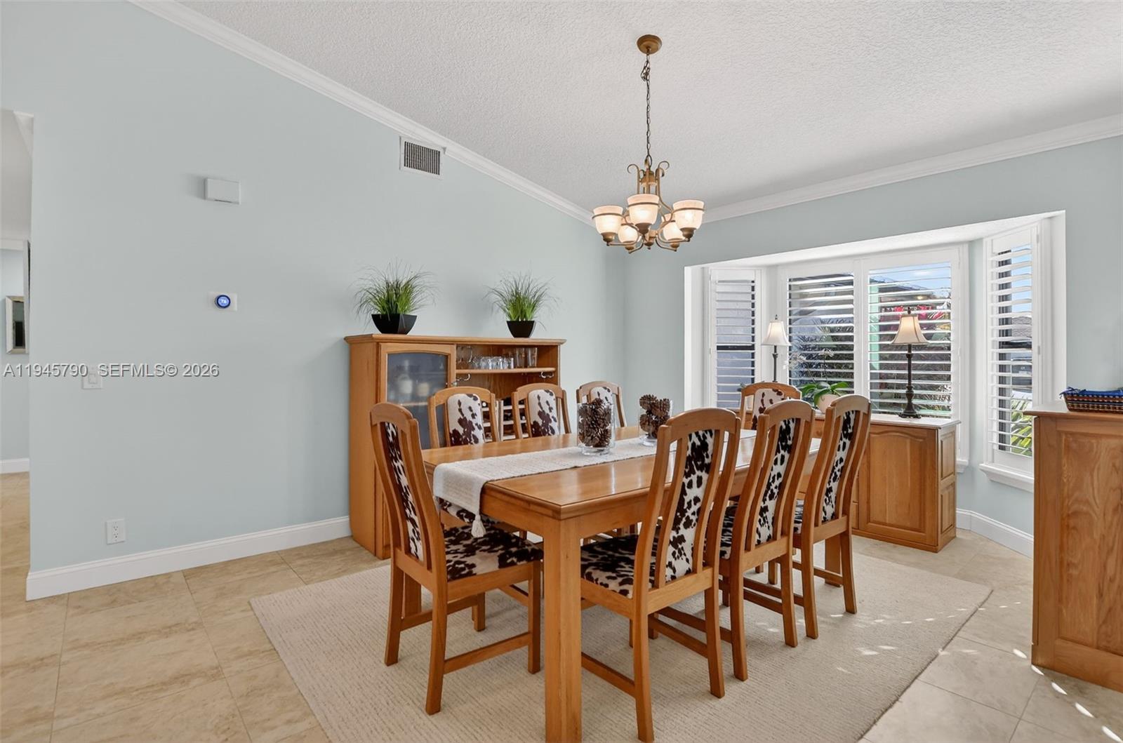 9943 Majorca Place Boca Raton, FL 33434 - Photo 7 of 48 a view of a dining room with furniture window and outside view