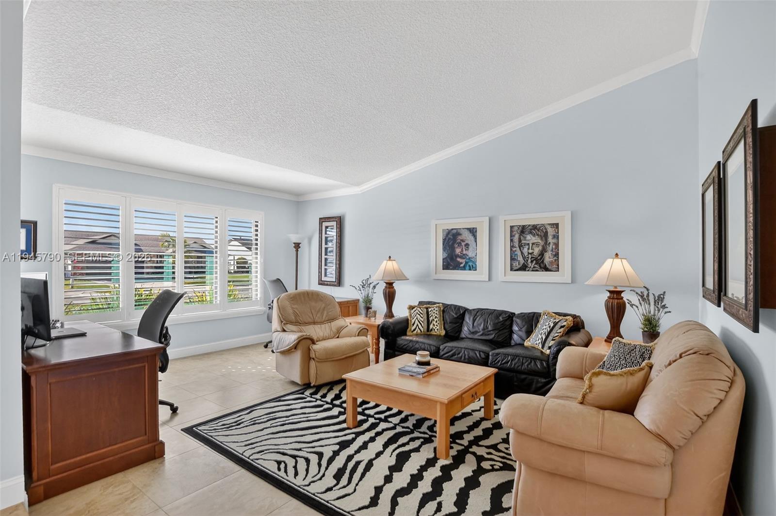 9943 Majorca Place Boca Raton, FL 33434 - Photo 9 of 48 a living room with furniture large windows and wooden floor