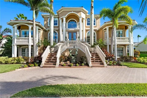 a front view of a residential apartment building with a yard