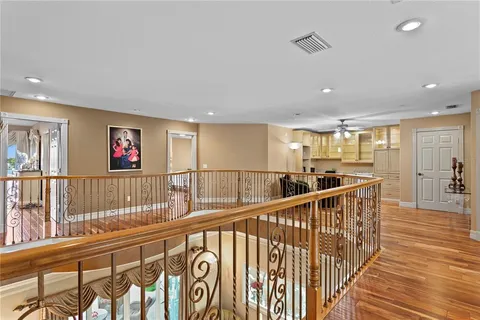 a living room with stainless steel appliances kitchen island granite countertop furniture and a large window