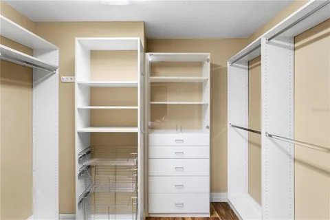 a bedroom with a bed and a table