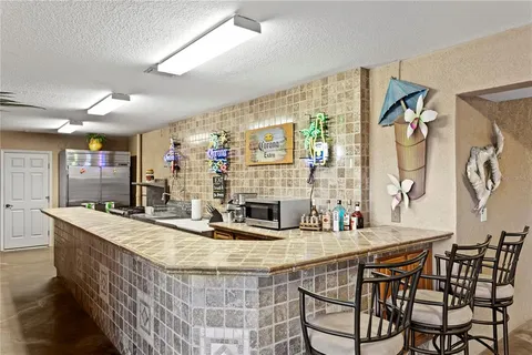 a view of an outdoor dining space with furniture and outdoor view