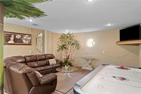 a view of a livingroom with furniture and a window