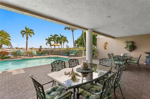 a view of a entryway door and dining room
