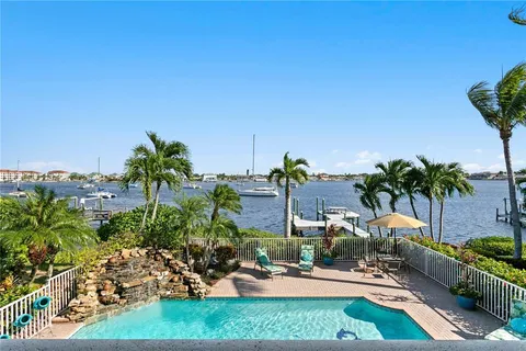 a view of a backyard with plants and patio