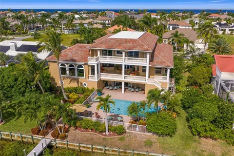 an aerial view of a houses with a lake view