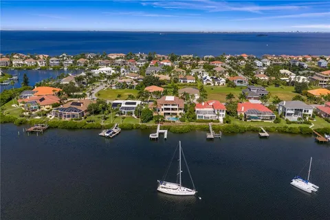 a view of a house with swimming pool and sitting area