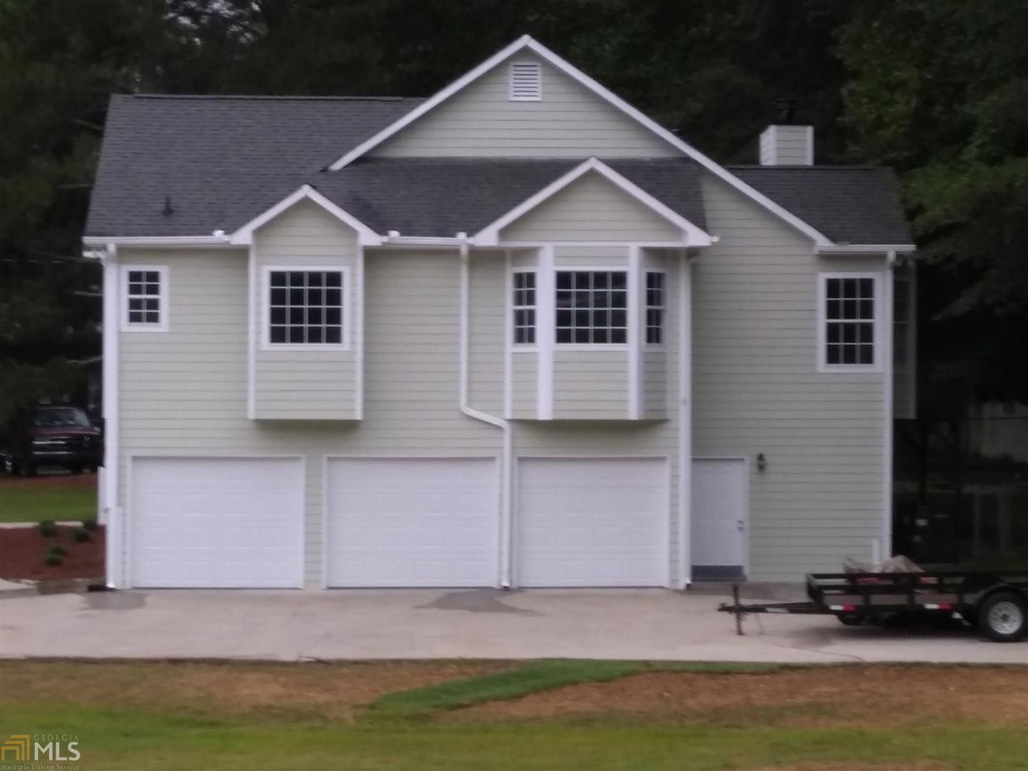 115 Hunter's Pointe Drive Villa Rica, GA 30180 - Photo 1 of 1 a front view of a house with a yard