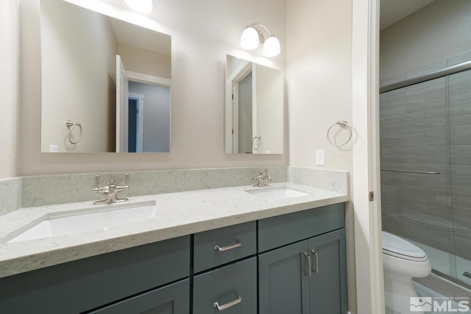 9500 Stony Hill Road Reno, NV 89521 - Photo 24 of 39 a bathroom with a sink and a mirror