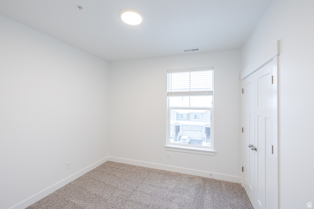 709 West 4500th South, Unit N302 Mapleton, UT 84664 - Photo 5 of 15 Unfurnished bedroom with a closet and light carpet