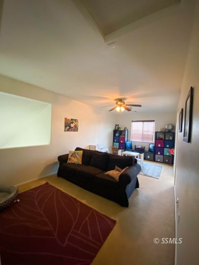 1109 Rebecca Avenue Ridgecrest, CA 93555 - Photo 40 of 50 a living room with furniture and a couch