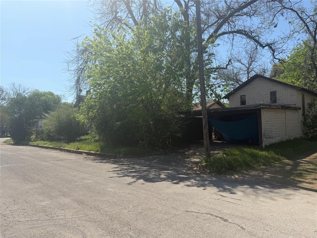 514 Tyler Street Waco, TX 76704 - Photo 6 of 11 a view of a house with a yard